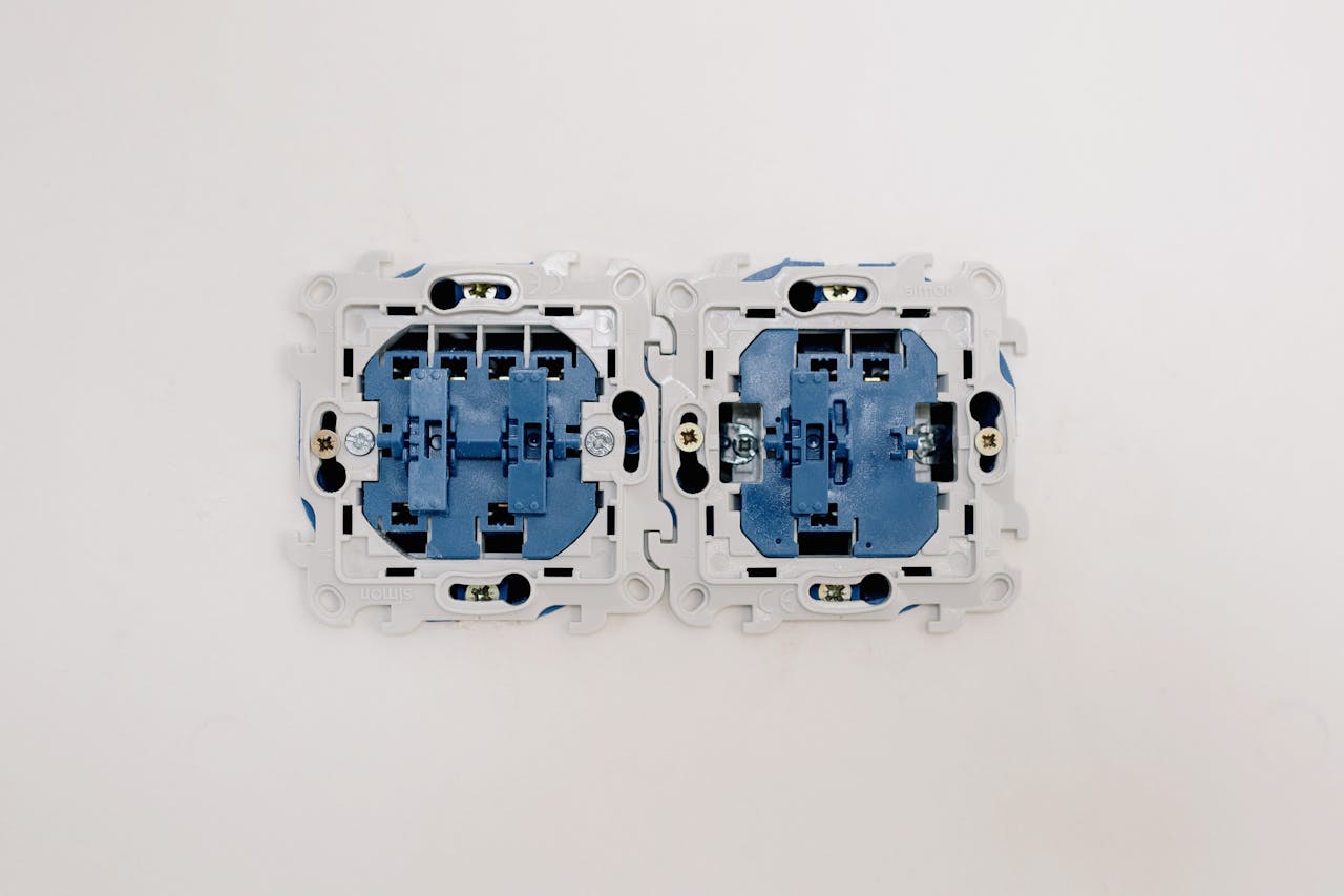 Detailed view of electrical sockets in a wall, ideal for renovation themes.